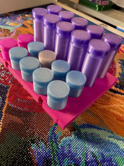 Purple and blue drill containers on pink stand, perfect for crafting and diamond painting, enhancing organization and style.